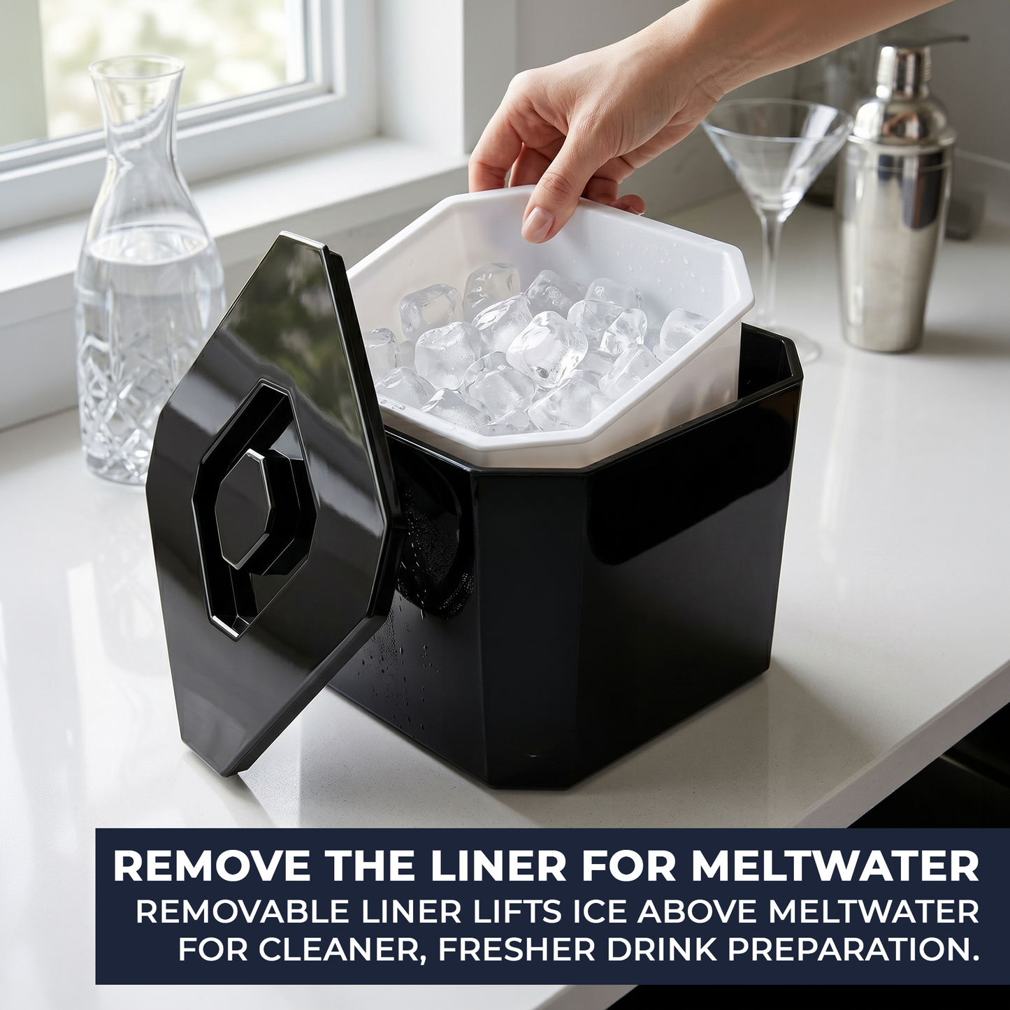 Black ice cube tray with removable liner on a kitchen counter.