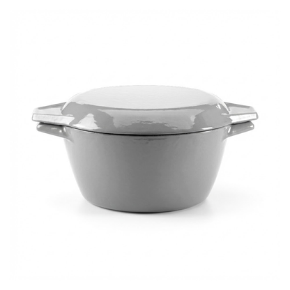 Gray enameled cast iron Dutch oven with a white lid on a white background