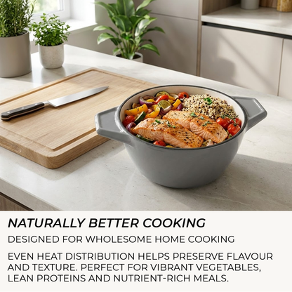 Gray pot with salmon and vegetables on a kitchen counter, with text about cooking.