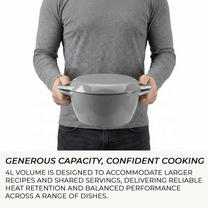 Person holding a large gray bowl with text about its capacity and performance.