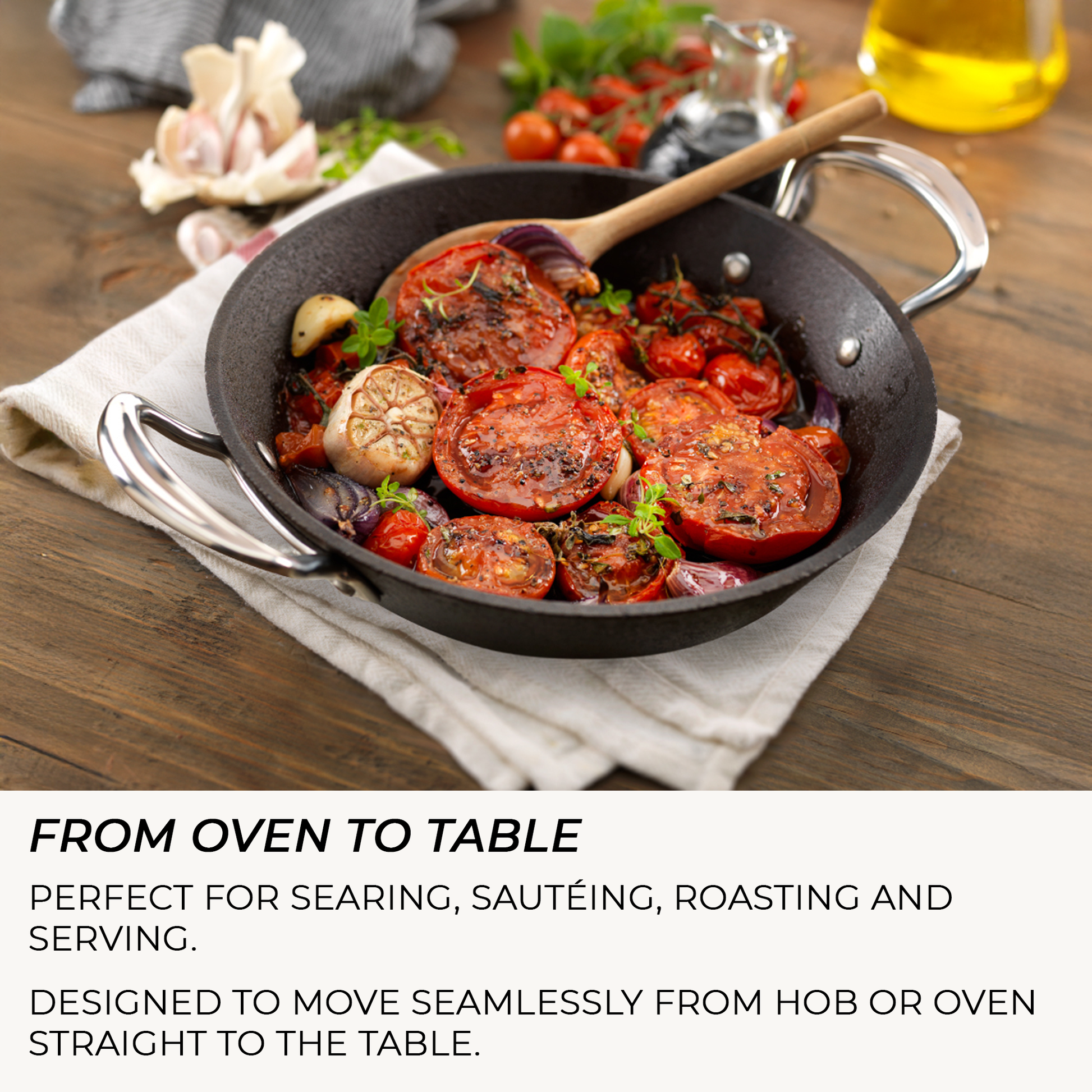 Frying pan with roasted tomatoes and garlic on a wooden table, with text about the pan's versatility.