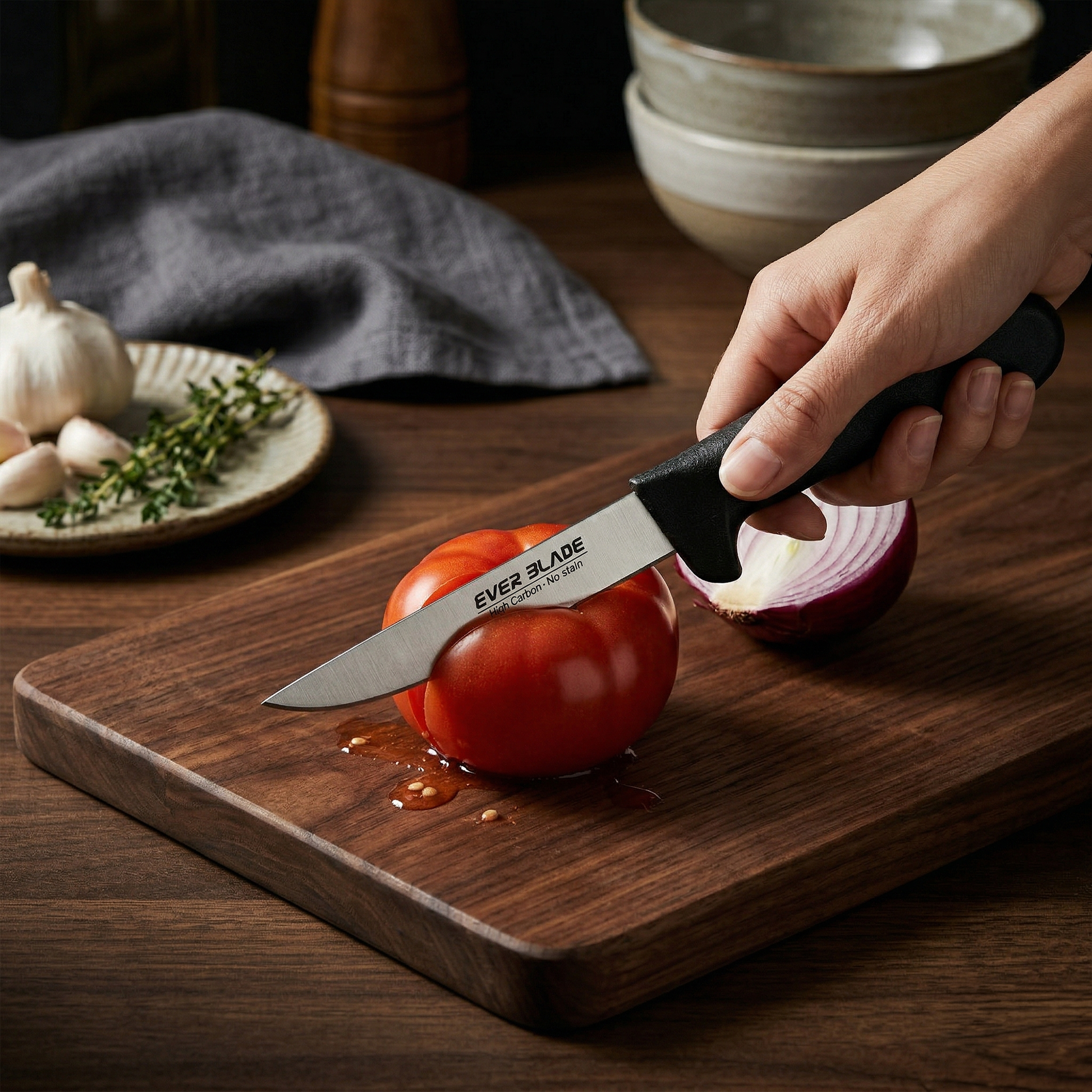 Person cutting a tomato on a wooden board with an Ever Blade knife.