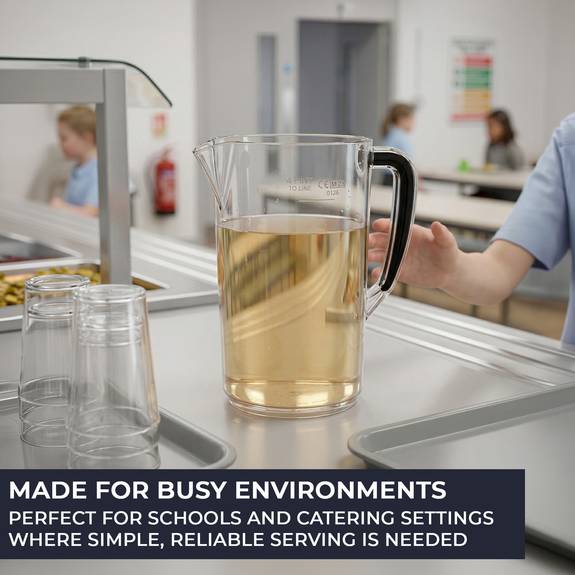Pitcher of liquid on a counter with text about busy environments and schools