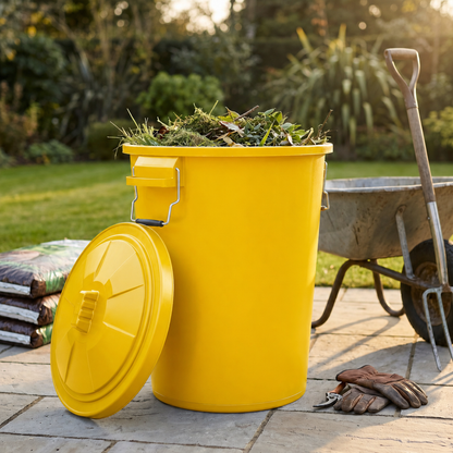 Yellow compost storage bin with locking lid for outdoor use