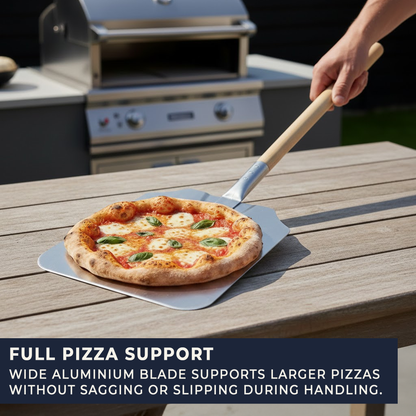 Angled view of large aluminium pizza paddle with long wooden handle